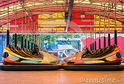 Dusty colored electric bumper cars or dodgem cars parked Stock Photo