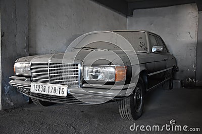 Dusty forgotten classic mercedes-benz w201 in garage in Algiers, Algeria, November 12, 2017 Editorial Stock Photo
