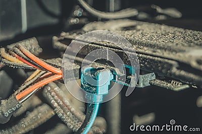 Dusty hard drive connection wires on your desktop computer. A layer of dust and dirt on the insulation of the power Stock Photo