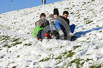 Dutch boys sledding in the snow on a hill Editorial Stock Photo