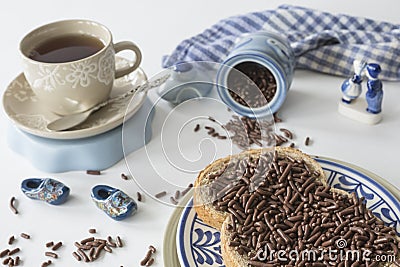 Dutch breakfast with bread and chocolate hail hagelslag, tea and Delfts Blue souvenir Stock Photo