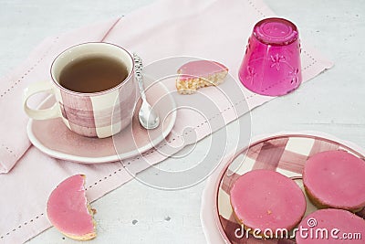 Dutch cake with pink frosting, called Roze Koek, against white grey backgruond Stock Photo