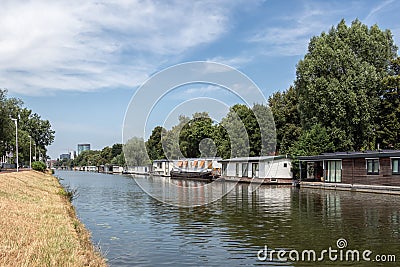 Dutch canal in city Utrecht with moored houseboats Stock Photo