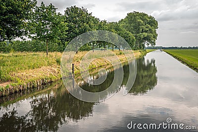 Dutch canal on a windless summer day Stock Photo
