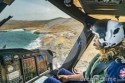 The Dutch Caribbean Coastguard - female pilot over Aruba Stock Photo