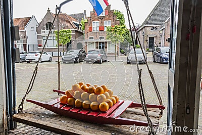 Traditional cheeses in old scales in the village of edam. netherlands Editorial Stock Photo