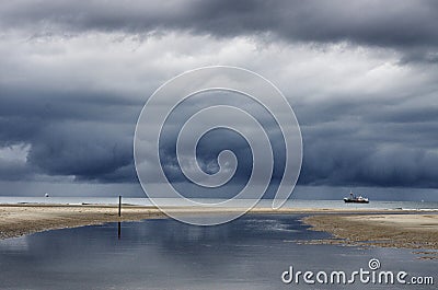 Dutch clouds with fishing boat Stock Photo