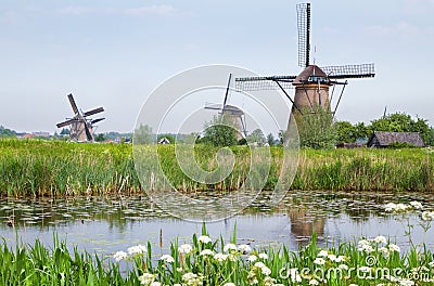 Dutch country landscape with windmills in spring Stock Photo