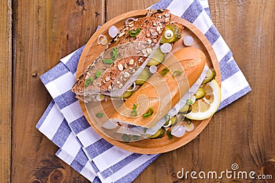 Dutch herring. Toast with Dutch herring, onions, pickles. Traditional rustic appetizer with seafood. Popular food in the Stock Photo
