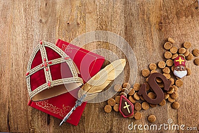 Dutch holiday Sinterklaas background with mitre or mijter staff and book of Sinterklaas. Stock Photo