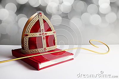 Dutch holiday Sinterklaas background with mitre or mijter staff and book of Sinterklaas. Stock Photo