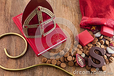 Dutch holiday Sinterklaas background with mitre or mijter staff and book of Sinterklaas. Stock Photo