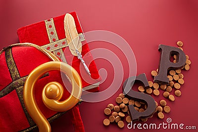 Dutch holiday Sinterklaas background with mitre or mijter staff and book of Sinterklaas. Stock Photo