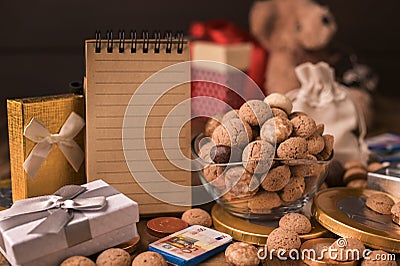 Dutch holiday Sinterklaas. cup with kruidnoten cookies and a gift for the child . Concept for children party Saint Stock Photo