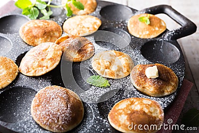 Dutch mini pancakes called poffertjes Stock Photo