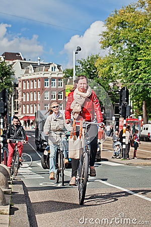 Dutch people on their bicycle, Amsterdam, netherlands. Editorial Stock Photo