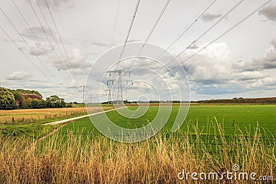 Dutch polder landscape with high voltages lines Stock Photo