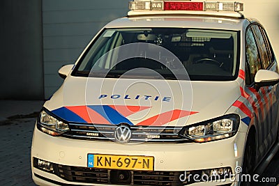 Dutch police car parked on the street in nieuwerkerk aan den Ijssel in the netherlands with text politie which means police in eng Editorial Stock Photo