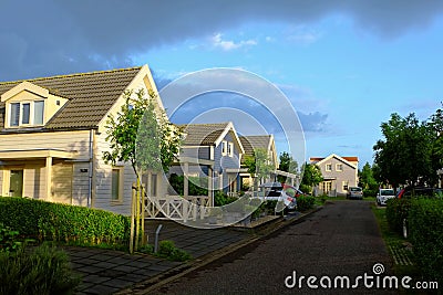 Cozy Dutch resort, holiday homes by sunrise in summer season Editorial Stock Photo