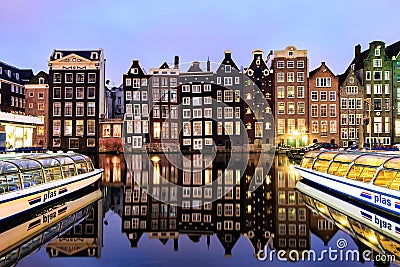 Dutch scenery with its canal side houses and tour boats Editorial Stock Photo