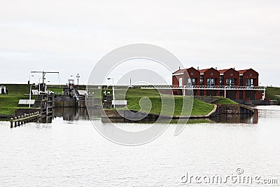 Dutch water pumping station and sash lock, Termuntenzijl Editorial Stock Photo
