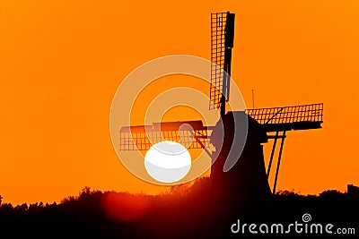 Dutch wind mill at a beautiful sunset Stock Photo