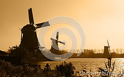 Dutch windmills silhouettes Stock Photo