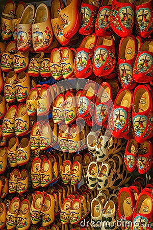 Dutch wooden shoes or wooden clogs, famous symbol of Netherlands, hanged in the shop Stock Photo