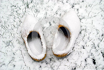 Dutch wooden shoes in the snow Stock Photo