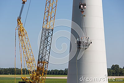 Dutch workers busy with the constuction of a new windturbine Stock Photo