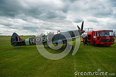 Duxford England May 2021 Double canopy world war two spitfire fighter with room for two people being prepared at the duxford Editorial Stock Photo