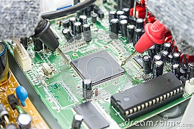 DVD Player motherboard repair close-up, electronic hardware concept. Stock Photo