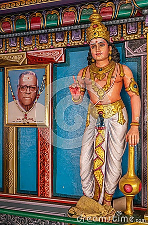 Dwarapalaka statue with photo of benefactor, Kadirampura, Karnataka, India Editorial Stock Photo