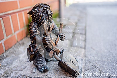 Dwarf with a padlock near bridge. Editorial Stock Photo