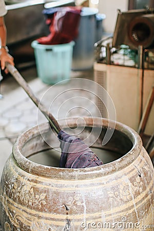 Dyeing silk, Using traditional natural materials, Raw multicolored cotton thread Stock Photo