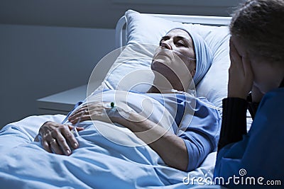 Dying elderly woman with tumor Stock Photo