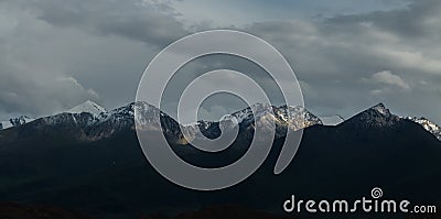 Dying sunlight on snow capped mountain peaks near Bokonbayevo, Kyrgyzstan, a popular centre for Community Based Tourism Editorial Stock Photo