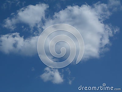 Dynamic bright white cumulus cloud under blue sky Stock Photo