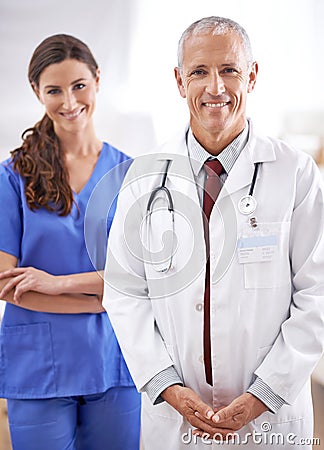 Dynamic doctoring duo. Portrait of two friendly medical professionals. Stock Photo