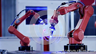 A dynamic image showing robotic arms in action each flexed position being reported by smart sensors that optimize their Stock Photo