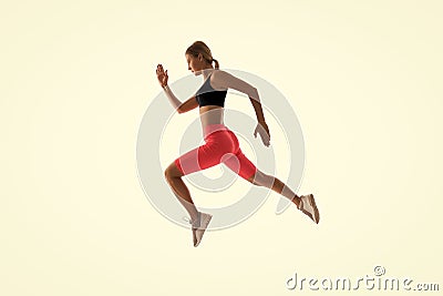 Dynamic movement. Woman runner isolated on white. Jogger running. Sporty runner in fashionable sportswear. Fitness and Stock Photo