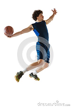 Dynamic portrait of young man, basketball player playing basketball isolated on white background. Concept of sport Stock Photo