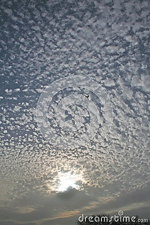 Dynamic sun covering clouds and patterns Stock Photo