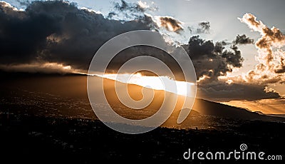 Dynamic sunset with clouds and light play Stock Photo