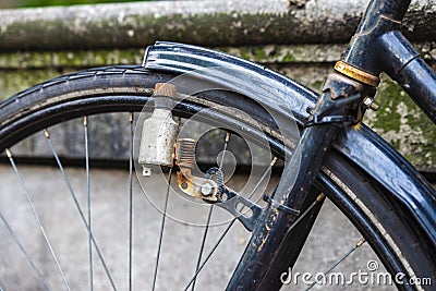 Dynamo of an old bicycle in Amsterdam, Netherlands Stock Photo