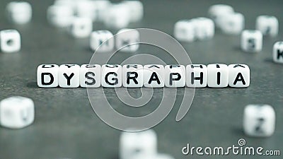 Dysgraphia word in white letter block beads. Front view. Dysgraphia concept. Stock Photo