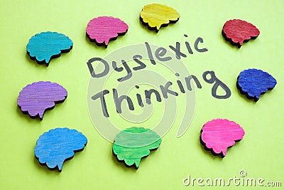 Dyslexic thinking sign and colorful brains around. Stock Photo