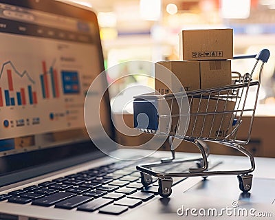 Ecommerce boom online shopping website on a laptop graph of rising sales in the background Stock Photo