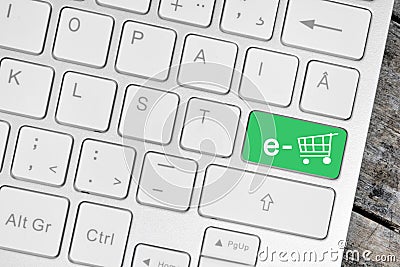 E-commerce on green button keyboard computer Stock Photo