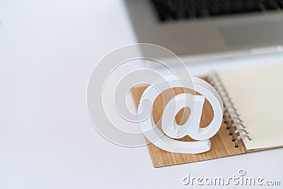 E-mail symbol in front of a laptop computer keyboard concept for email, communication or contact us Stock Photo